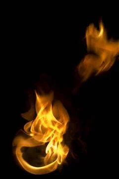Isolated fire flames on black background, darkness fire with a black backg... Stock Photos