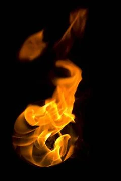 Isolated fire flames on black background, darkness fire with a black backg... Stock Photos