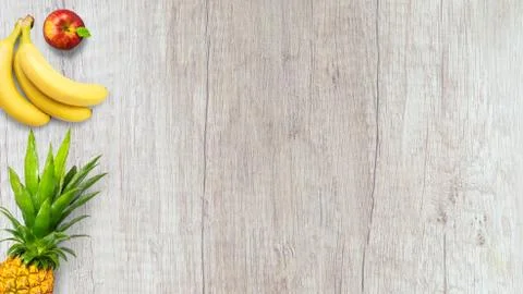 Isolated flat top view of different types of fruits on a wooden background wi Stock Photos