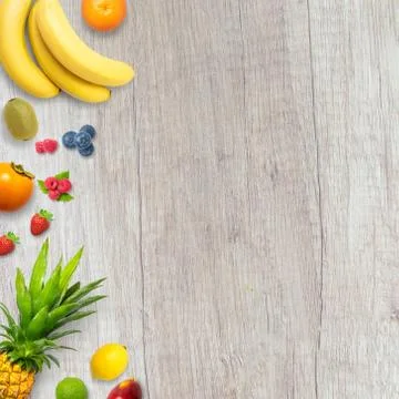 Isolated flat top view of different types of fruits on a wooden background wi Stock Photos