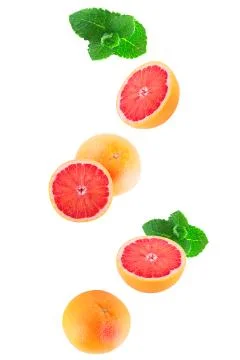 Isolated flying grapefruits with mint Stock Photos