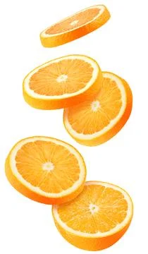 Isolated flying oranges. Falling sliced orange fruit isolated on white Stock Photos
