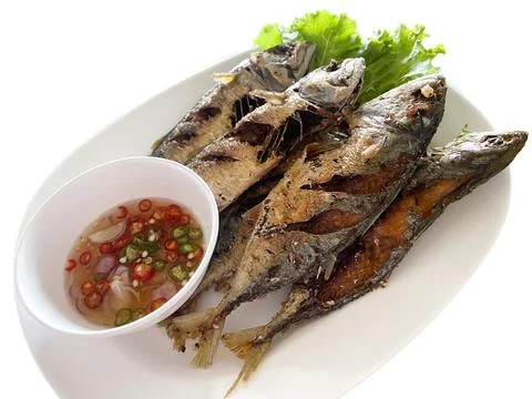 Isolated Fried short mackerel served with paprika fish sauce. Asian food, F.. Stock Photos