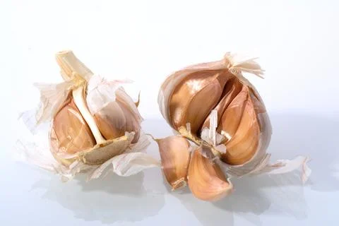 Isolated garlic. Raw garlic segment isolated on white background, with clippi Stock Photos