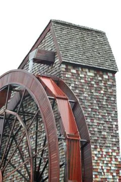 Isolated giant water wheel for a old mill Stock Photos