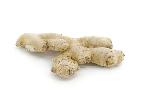 Isolated ginger root on bright white background, showing fibrous texture an.. Stock Photos