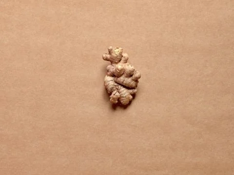 Isolated ginger root over a brown background Stock Photos
