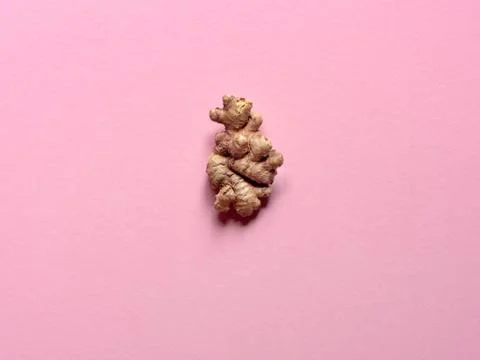Isolated ginger root over a pink background Stock Photos