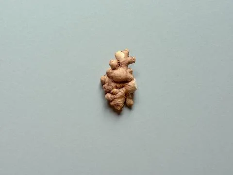 Isolated ginger root over a yellow background Stock Photos