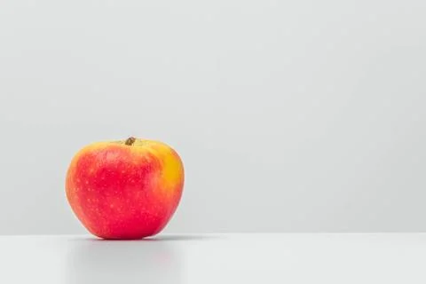 Isolated grapefruit with reflection on a table. Light background Stock Photos