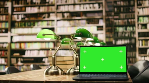 Isolated green screen mockup on laptop inside empty library Stock Footage 336357888