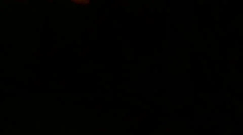 Isolated hand with candle slow motion black background Stock Footage 57853809