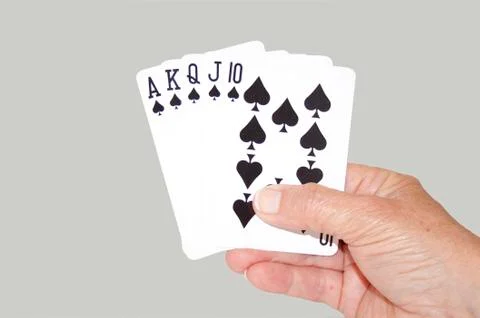 Isolated hand held royal flush of spades Stock Photos