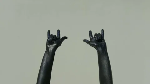 Isolated Hands on grey background covered with black paint Stock Footage 76808718