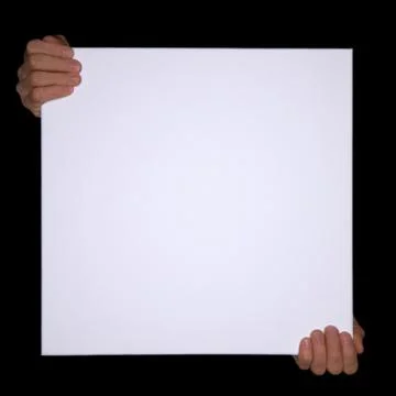 Isolated hands holding a empty canvas on black Background with copyspace Stock Photos