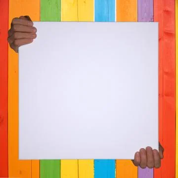 Isolated hands holding a empty canvas with colorful background and copyspace Stock Photos