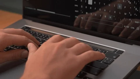 Isolated hands typing on keyboard Close up hands coding on computer Stock Footage 129386934