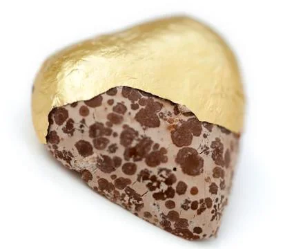 Isolated heart shaped moldy chocolate Stock Photos