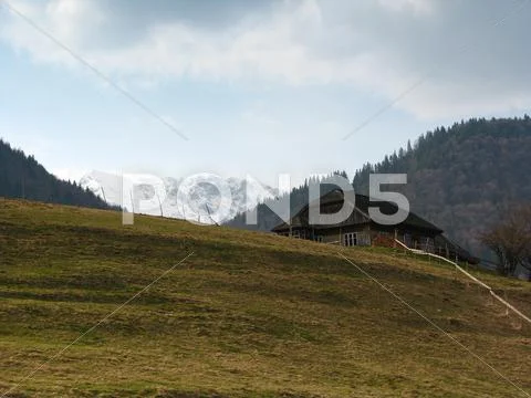 Isolated house in mountains Stock Photos