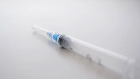 Isolated Hypodermic Needle Dropping and Bouncing in Slow Motion Stock Footage 112474023
