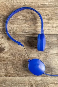 Isolated image of a blue headphone with adjustable head band. One of the ear  Stock Photos