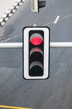 An Isolated Intersection: A Traffic Light Displaying a Red Signal Over an Emp Stock Photos
