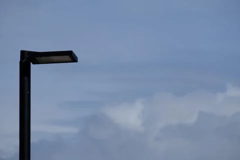 Isolated LED lamppost and cloudy sky Stock Photos