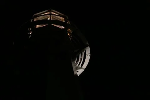 An isolated lighthouse light at night Foto stock