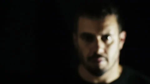 Isolated man on black background makes gesture to stop someone or something Video stock 41769347