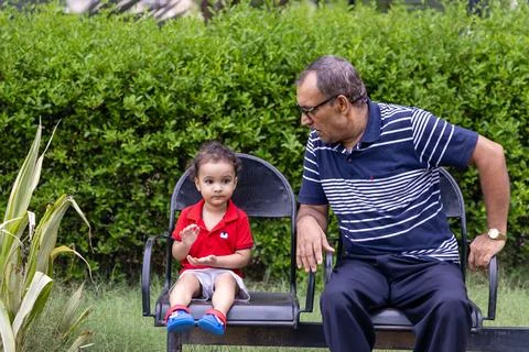 Isolated man spending quality time with grandson at outdoor park at evening.. Stock-Fotos