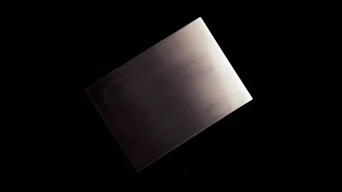 Isolated metal plate with abstract texture rotating on a black background Stock Footage 156361653