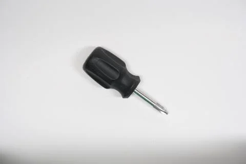 Isolated mini screw driver phillips head on a white background Stock Photos