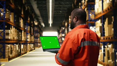Isolated mockup on laptop PC with black worker in industrial depot facility Stock Footage 332907782