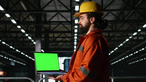 Isolated mockup on laptop with professional engineer in heavy industry warehouse Stock Footage 330205401
