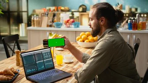 Isolated mockup on mobile phone screen used at home in kitchen 스톡 사진