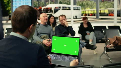 Isolated mockup screen on laptop with man traveler sitting in waiting area Stock Footage 334728179