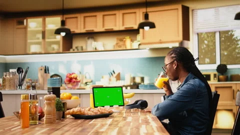 Isolated mockup screen on tablet screen in sunlit kitchen at table Stock Footage 344245403