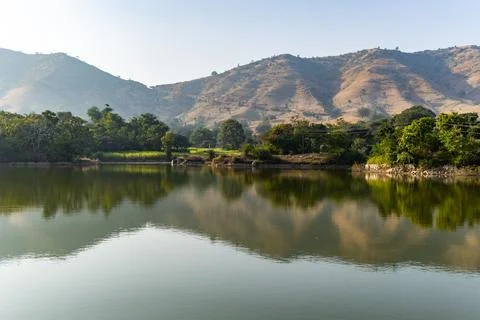 Isolated mountain range with pristine lake reflection at morning from flat .. 写真素材