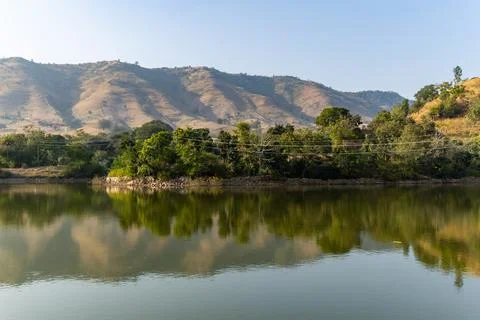 Isolated mountain range with pristine lake reflection at morning from flat .. 写真素材