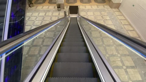 Isolated moving escalator going up from flat angle at morning video is taken at Stock Footage 246710492
