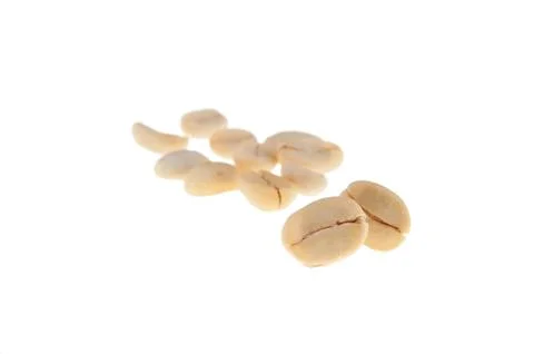 Isolated, not roasted raw coffee seeds Stock Photos