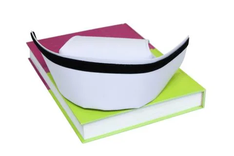 An isolated nurse hat on textbook Stock Photos