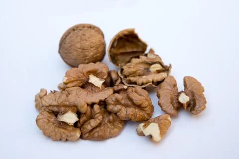 Isolated nuts pattern backdrop. Close-up of walnut kernels. Stock Photos
