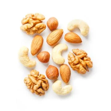 Isolated nuts pattern background. Walnut, cashew, almond and hazelnut on whit 스톡 사진