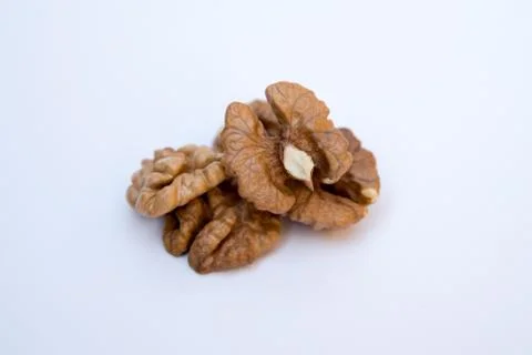 Isolated nuts pattern white backdrop. Close-up of walnut kernels. Stock Photos