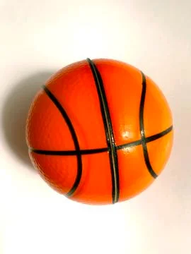 Isolated object - an orange ball on a light background. Stock Photos