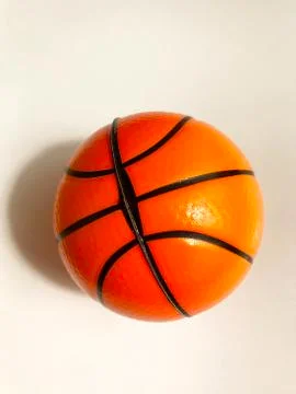 Isolated object - an orange ball on a light background. Stock Photos