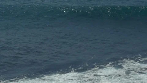 An isolated ocean wave in slow motion Stock Footage 84809587
