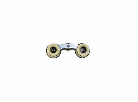 Isolated opera glasses on a white background. Old vintage ivory pair of opera Stock Photos