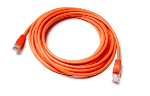 Isolated orange patch cord internet cable on white background Fotos de archivo